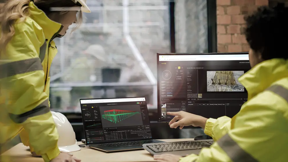 image of GazdronyX  logo and men in front of multiple screens